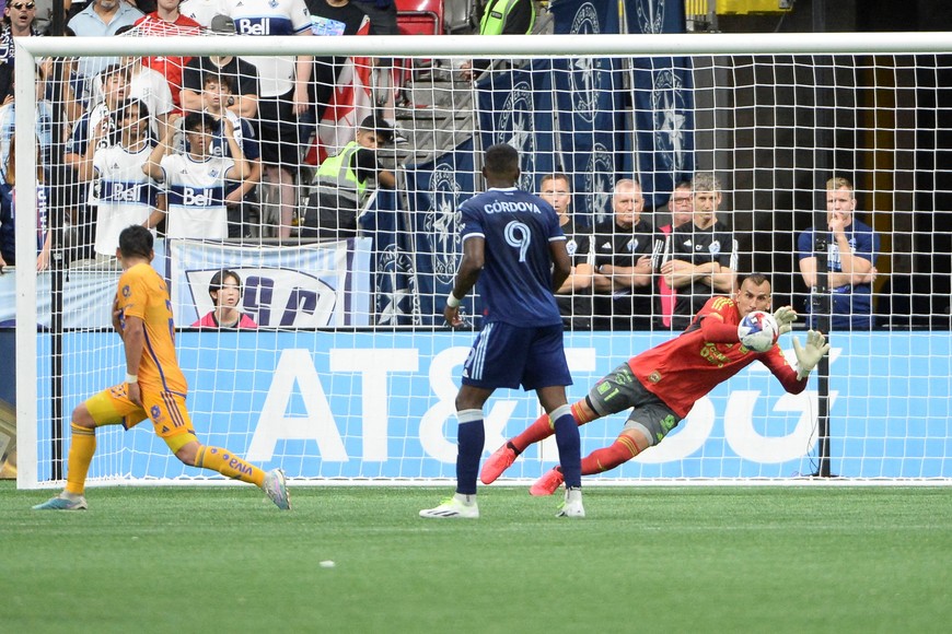 Aug 4, 2023; Vancouver, BC, CAN;  Club Tigres goalkeeper Nahuel Guzman (1) blocks a shot by Vancouver Whitecaps FC forward Sergio Cordova (9) during the second half at BC Place. Mandatory Credit: Anne-Marie Sorvin-USA TODAY Sports