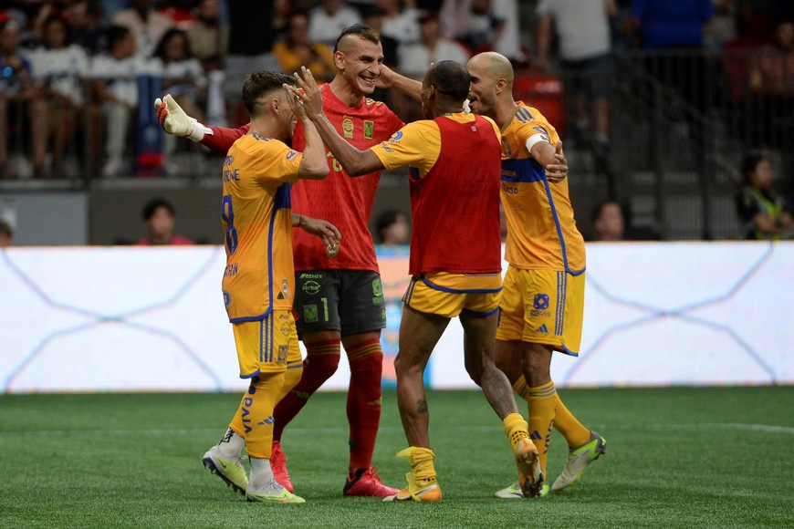 Aug 4, 2023; Vancouver, BC, CAN;  Club Tigres goalkeeper Nahuel Guzman (1) celebrates with midfielder Fernando Gorriaran (8) after he scored the final shot to win over the Vancouver Whitecaps FC in the penalty shootout at BC Place. Mandatory Credit: Anne-Marie Sorvin-USA TODAY Sports