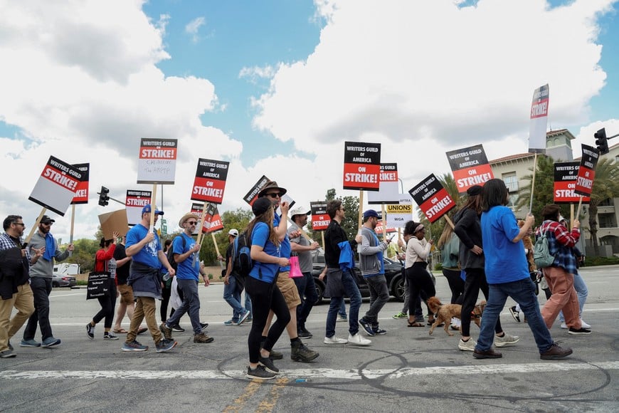 Workers and supporters of the Writers Guild of America protest outside Universal Studios Hollywood after union negotiators called a strike for film and television writers, in the Universal City area of Los Angeles, California, U.S., May 3, 2023. REUTERS/Mario Anzuoni/