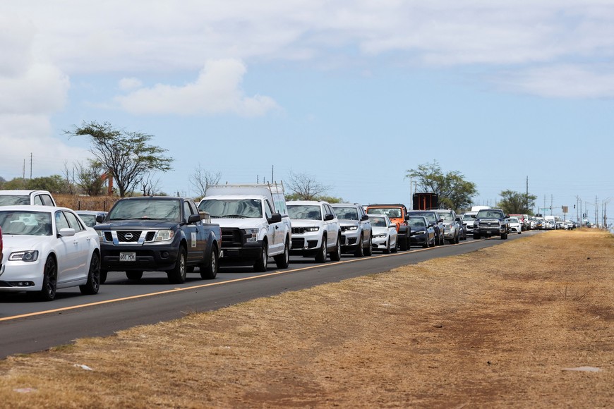 Vehicles are seen in traffic on Honoapiilani Hwy after officials allowed residents and tourists back into West Maui after a wildfire destroyed the historic town of Lahaina, in Maui, Hawaii, U.S. August 11, 2023. REUTERS/Marco Garcia