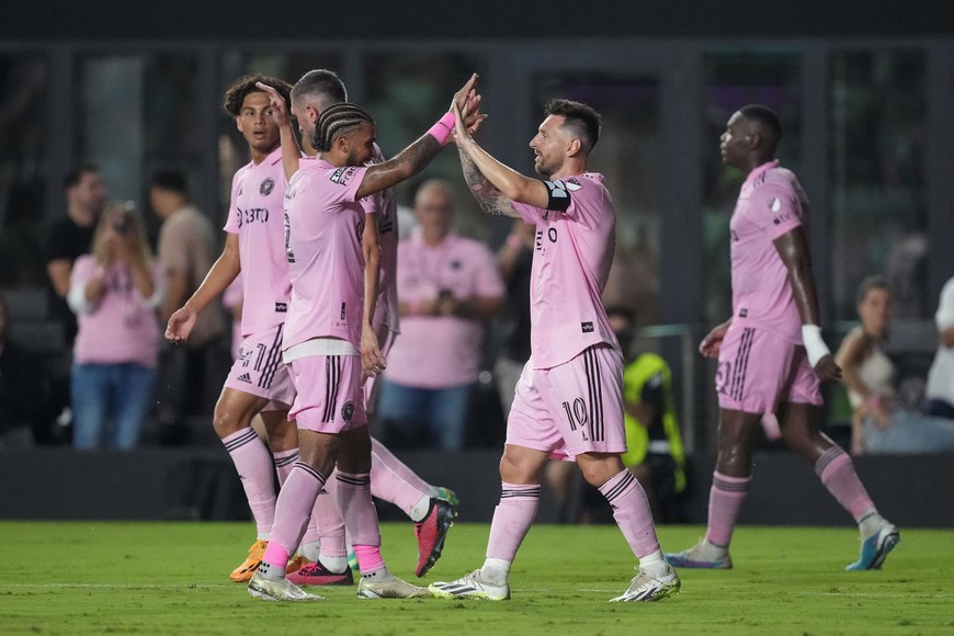 Aug 11, 2023; Fort Lauderdale, FL, USA; Inter Miami CF forward Lionel Messi (10) celebrates with defender DeAndre Yedlin (2) after a goal in the second half against Charlotte FC at DRV PNK Stadium. Mandatory Credit: Kirby Lee-USA TODAY Sports