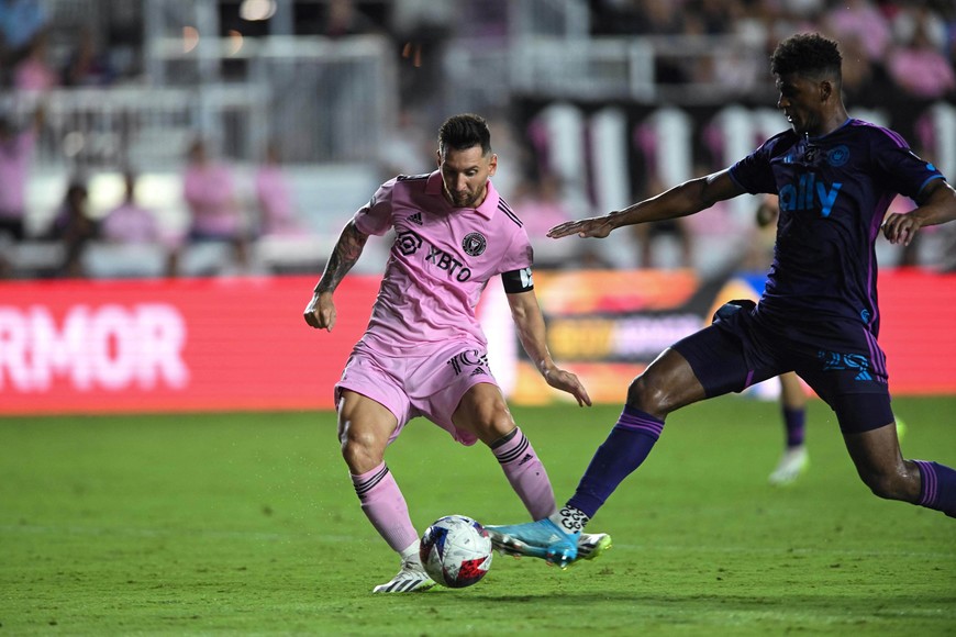 Aug 11, 2023; Fort Lauderdale, FL, USA; Inter Miami CF forward Lionel Messi (10) controls the ball under pressure from Charlotte FC defender Adilson Malanda (29) in the second half at DRV PNK Stadium. Mandatory Credit: Jeremy Reper-USA TODAY Sports