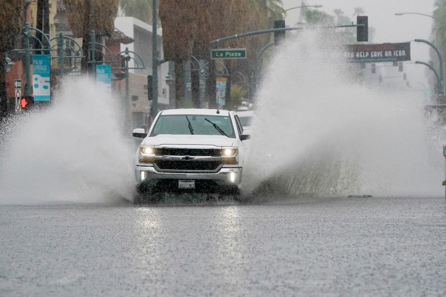 A truck moves through standing water as Tropical Storm Hilary approaches Palm Springs, California, U.S., August 20, 2023.  REUTERS/Bryan Woolston     TPX IMAGES OF THE DAY