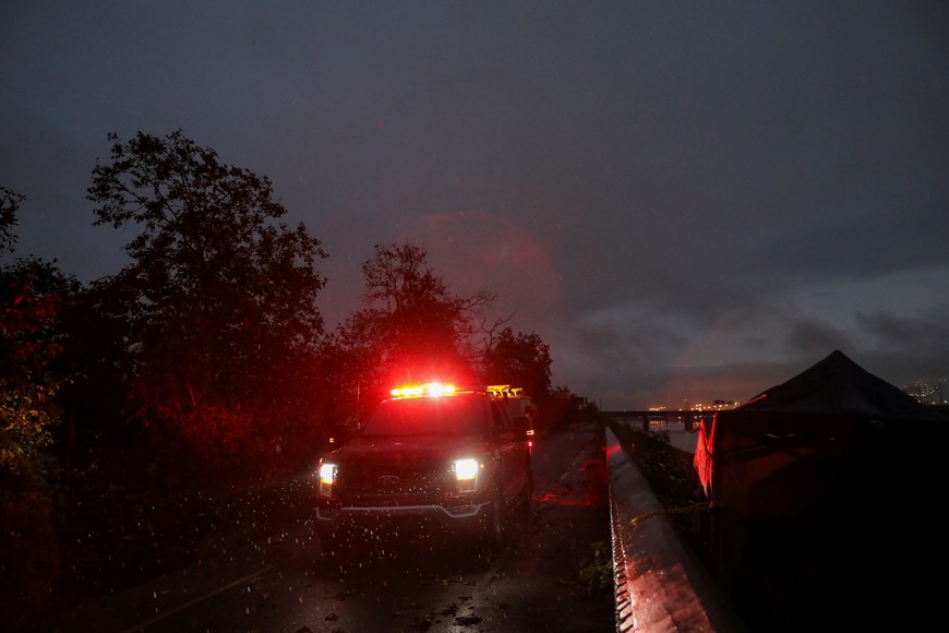 A Long Beach Fire Department truck drives along the bike path of the Los Angeles River in Long Beach as Tropical Storm Hilary makes its way through Southern California, U.S. August 20, 2023. REUTERS/Zaydee Sanchez