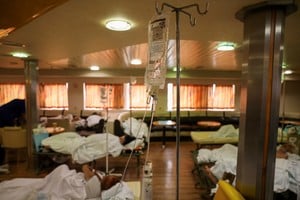 Patients from the General University Hospital of Alexandroupolis are seen inside a ferry after being evacuated, as a wildfire rages in Alexandroupolis, on the region of Evros, Greece, August 22, 2023. REUTERS/Alexandros Avramidis