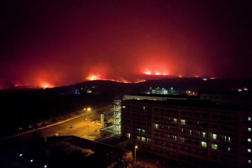 A wildfire burns near a hospital in Alexandroupolis, in the region of Evros, Greece, August 22, 2023. REUTERS/Alexandros Avramidis