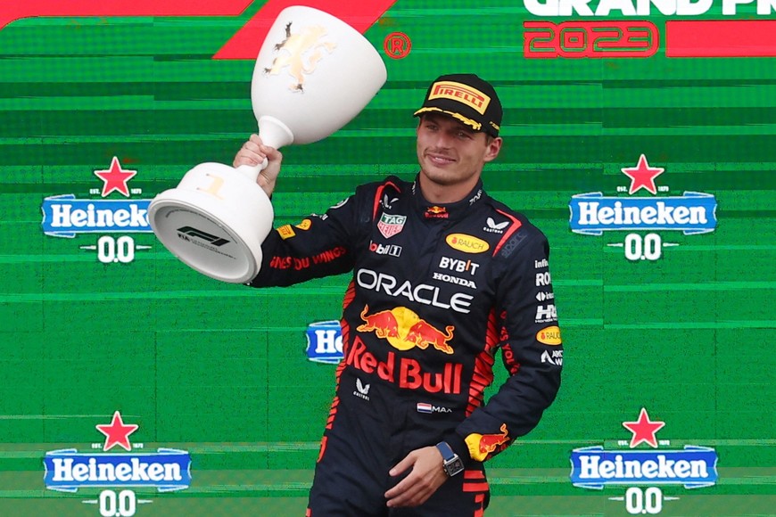 Formula One F1 - Dutch Grand Prix - Circuit Zandvoort, Zandvoort, Netherlands - August 27, 2023
Red Bull's Max Verstappen celebrates with a trophy on the on the podium after winning the Dutch Grand Prix REUTERS/Yves Herman