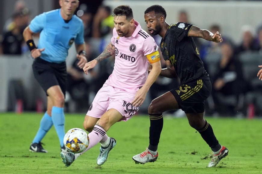 Sep 3, 2023; Los Angeles, California, USA; Los Angeles FC midfielder Kellyn Acosta (23) and Inter Miami CF forward Lionel Messi (10) battle for the ball in the first half at BMO Stadium. Mandatory Credit: Kirby Lee-USA TODAY Sports