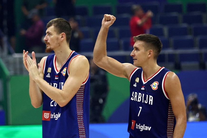 FILE PHOTO: Basketball - FIBA World Cup 2023 - First Round - Group B - Puerto Rico v Serbia - Araneta Coliseum, Quezon, Philippines - August 28, 2023
Serbia's Borisa Simanic celebrates with Serbia's Bogdan Bogdanovic after winning the match REUTERS/Eloisa Lopez/File Photo