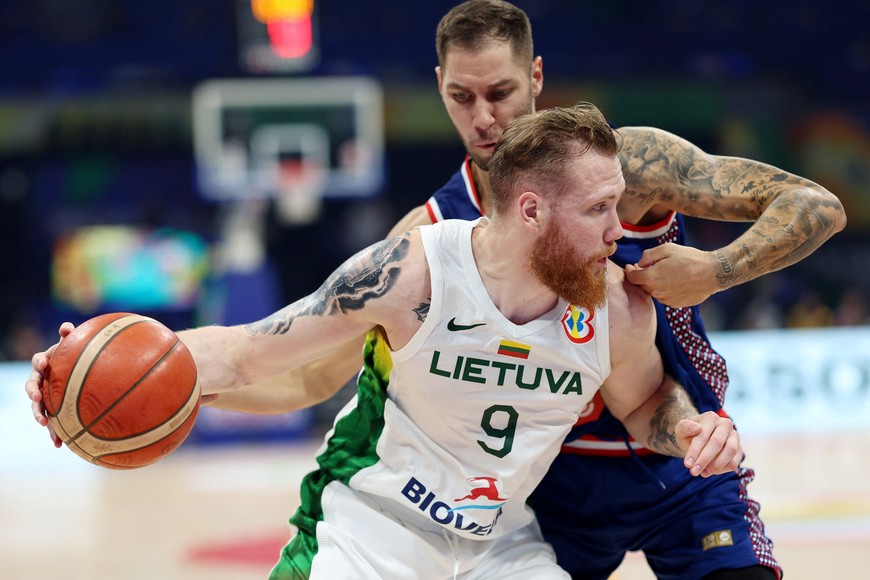 Basketball - FIBA World Cup 2023 - Quarter-Final - Lithuania v Serbia - Mall of Asia Arena, Manila, Philippines - September 5, 2023
Lithuania's Ignas Brazdeikis in action with Serbia's Stefan Jovic REUTERS/Eloisa Lopez