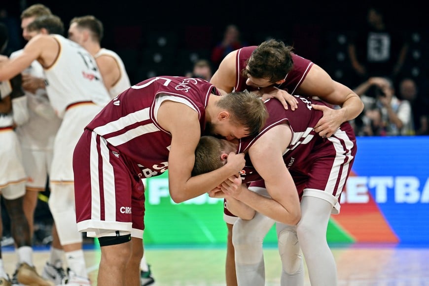 Basketball - FIBA World Cup 2023 - Quarter-Final - Germany v Latvia - Mall of Asia Arena, Manila, Philippines - September 6, 2023
Latvia players look dejected after the match REUTERS/Lisa Marie David