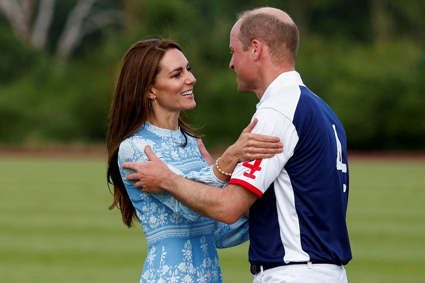 Britain's Prince William and Catherine, Princess of Wales, hold each other at the Royal Charity Polo Cup event in Windsor, Britain July 6, 2023. REUTERS/Peter Nicholls     TPX IMAGES OF THE DAY