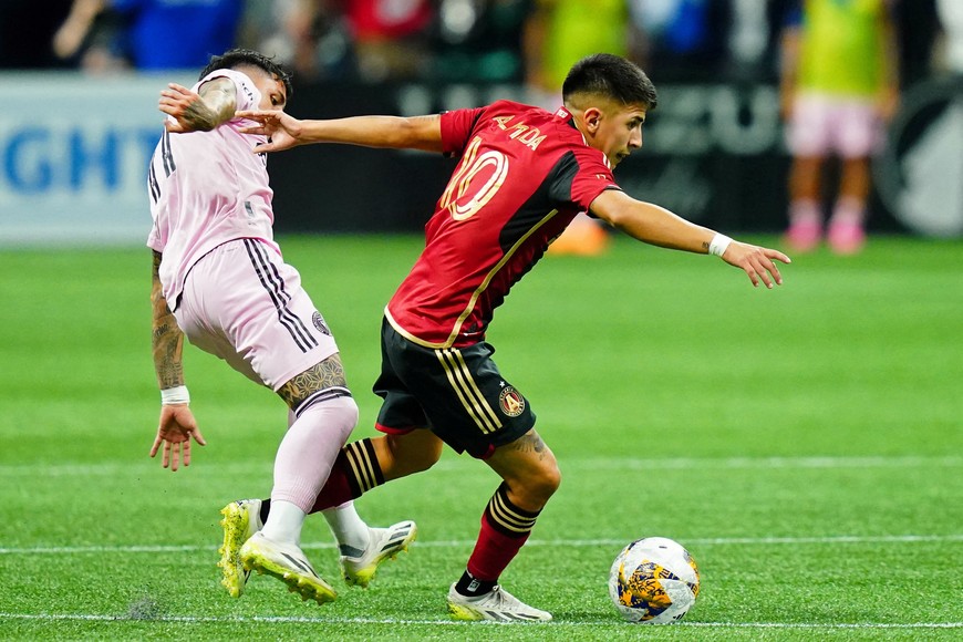 Sep 16, 2023; Atlanta, Georgia, USA; Inter Miami CF midfielder Facundo Farias (11) fouls Atlanta United midfielder Luiz Araujo (10) and received a yellow card during the second half at Mercedes-Benz Stadium. Mandatory Credit: John David Mercer-USA TODAY Sports