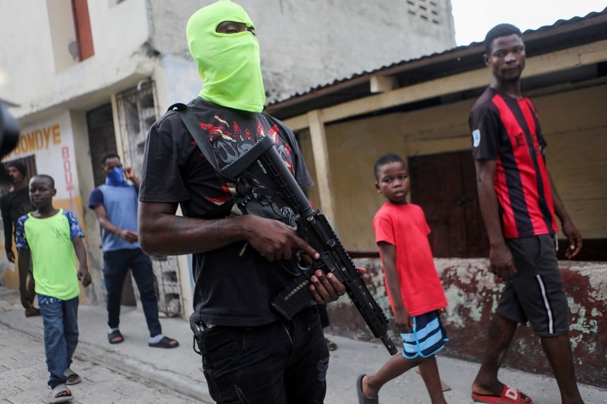 Former police officer Jimmy "Barbecue" Cherizier (not pictured), leader of the 'G9' coalition, is accompanied by Security during a march against Haiti's Prime Minister Ariel Henry, in Port-au-Prince, Haiti September 19, 2023. REUTERS/Ralph Tedy Erol