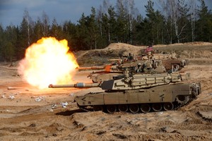 FILE PHOTO: U.S. Army M1A1 Abrams tank fires during NATO enhanced Forward Presence battle group military exercise Crystal Arrow 2021 in Adazi, Latvia March 26, 2021 REUTERS/Ints Kalnins/File Photo