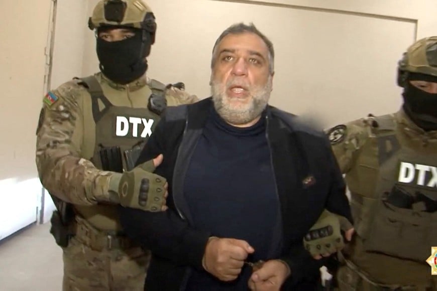 Law enforcement officers escort Ruben Vardanyan, the former head of government of the breakaway Nagorno-Karabakh region, after he was arrested by the Azerbaijani security service and accused of illegally crossing the Azerbaijani border and financing terrorism, at an unknown location in Azerbaijan, in this still image from video released September 28, 2023. State Security Service of Azerbaijan/Handout via REUTERS ATTENTION EDITORS - THIS IMAGE WAS PROVIDED BY A THIRD PARTY. NO RESALES. NO ARCHIVES. MANDATORY CREDIT. PICTURE WATERMARKED AT SOURCE.