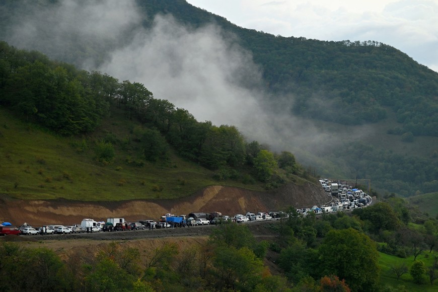 Vehicles carrying refugees from Nagorno-Karabakh, a region inhabited by ethnic Armenians, queue on the road leading towards the Armenian border, in Nagorno-Karabakh, September 25, 2023. After a lightning operation by Azerbaijan's military to retake control of Nagorno-Karabakh, the stream of ethnic Armenians fleeing the region to Armenia quickly turned into a flood. REUTERS/David Ghahramanyan     SEARCH "GHAHRAMANYAN NAGORNO-KARABAKH" FOR THIS STORY. SEARCH "WIDER IMAGE" FOR ALL STORIES.     TPX IMAGES OF THE DAY
