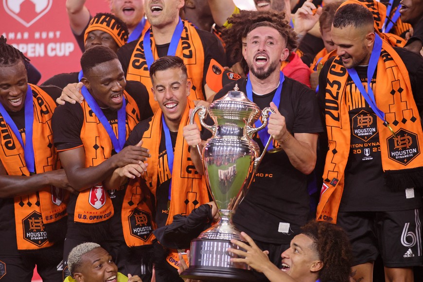 Sep 27, 2023; Fort Lauderdale, FL, USA; Houston Dynamo midfielder Hector Herrera (16) celebrates with teammates after winning the Lamar Hunt U.S. Open Cup Final against Inter Miami CF at DRV PNK Stadium. Mandatory Credit: Sam Navarro-USA TODAY Sports