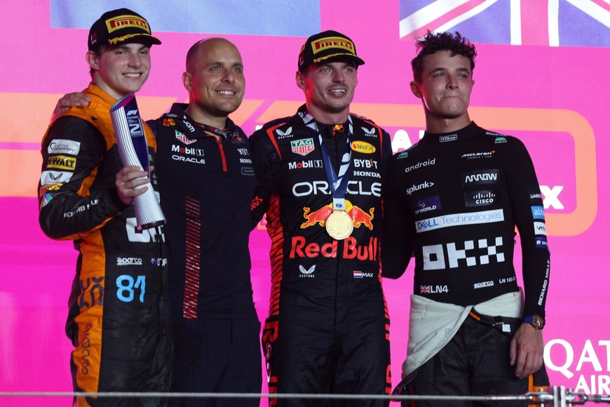Formula One F1 - Qatar Grand Prix - Lusail International Circuit, Lusail, Qatar - October 8, 2023
Second placed Oscar Piastri of McLaren, a Red Bull team member, first placed Max Verstappen of Red Bull and third placed Lando Norris of McLaren pose for a photo on the podium during the trophy presentation after the race REUTERS/Ibraheem Al Omari