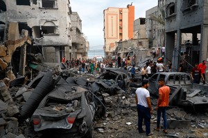 Palestinians inspect damages in the aftermath of Israeli strikes, following a Hamas surprise attack, at Beach refugee camp, in Gaza City, October 9, 2023. REUTERS/Mohammed Salem