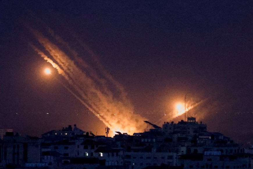 Rockets are fired from Gaza towards Israel, in Gaza October 9, 2023. REUTERS/Mohammed Salem