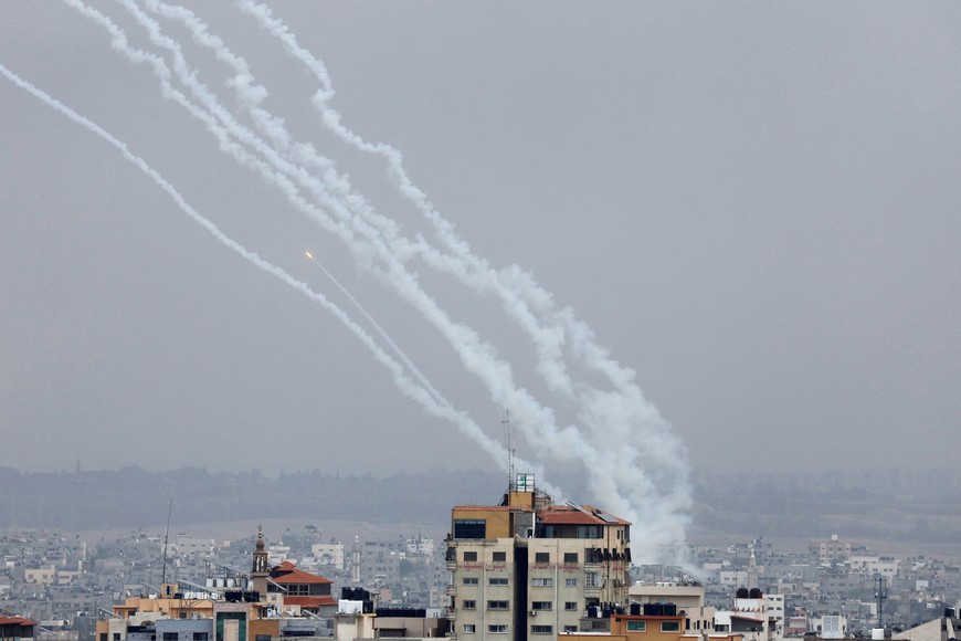 Rockets are fired from Gaza towards Israel, in Gaza, October 9, 2023. REUTERS/Mohammed Salem