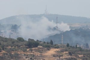 Smoke rises from Dhayra village after Israeli shelling as pictured from the Lebanese town of Marwahin, near the border with Israel, southern Lebanon, October 11, 2023. REUTERS/Mohamed Azakir