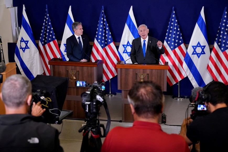 Israel’s Prime Minister Benjamin Netanyahu makes a statement to the media inside The Kirya, which houses the Israeli Ministry of Defense, after a meeting with U.S. Secretary of State Antony Blinken, in Tel Aviv, Israel, Thursday Oct. 12, 2023. Jacquelyn Martin/Pool via REUTERS