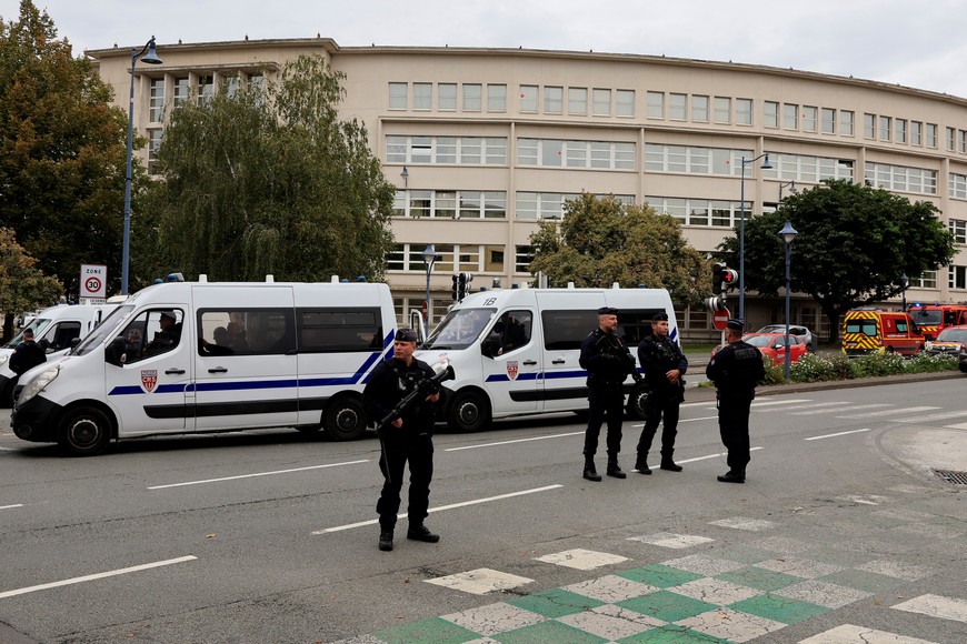 French police secure the area after a teacher was killed and several people injured in a knife attack at the Lycee Gambetta-Carnot high school in Arras, northern France, October 13, 2023. REUTERS/Pascal Rossignol