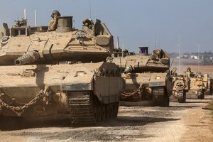 Israeli tanks and military vehicles take position near Israel's border with the Gaza Strip, in southern Israel, October 13, 2023. REUTERS/Violeta Santos Moura     TPX IMAGES OF THE DAY