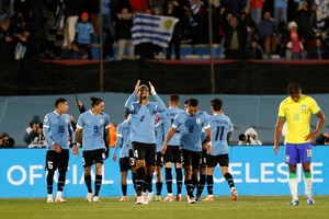 Soccer Football - World Cup - South American Qualifiers - Uruguay v Brazil - Estadio Centenario, Montevideo, Uruguay - October 17, 2023
Uruguay's Ronald Araujo celebrates their second goal scored by Nicolas de la Cruz REUTERS/Andres Cuenca