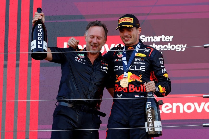 Formula One F1 - Japanese Grand Prix - Suzuka Circuit, Suzuka, Japan - September 24, 2023
Red Bull's Max Verstappen celebrates on the podium with team principal Christian Horner Red Bull after winning the Japanese Grand Prix and the constructors title REUTERS/Issei Kato