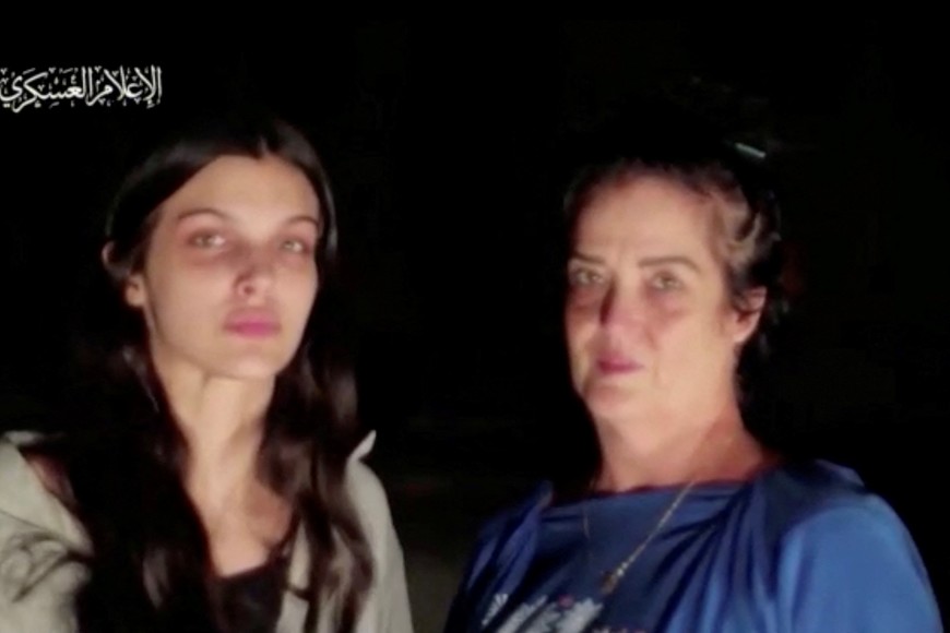 Judith Tai Raanan and her daughter Natalie Shoshana Raanan, U.S. citizens who were taken as hostages by Palestinian Hamas militants, look on after they were released by the militants, in response to Qatari mediation efforts, in Gaza Strip, in this still picture taken from a video obtained by Reuters on October 21, 2023.  Al-Qassam Brigade via Telegram/Handout via REUTERS THIS IMAGE HAS BEEN SUPPLIED BY A THIRD PARTY