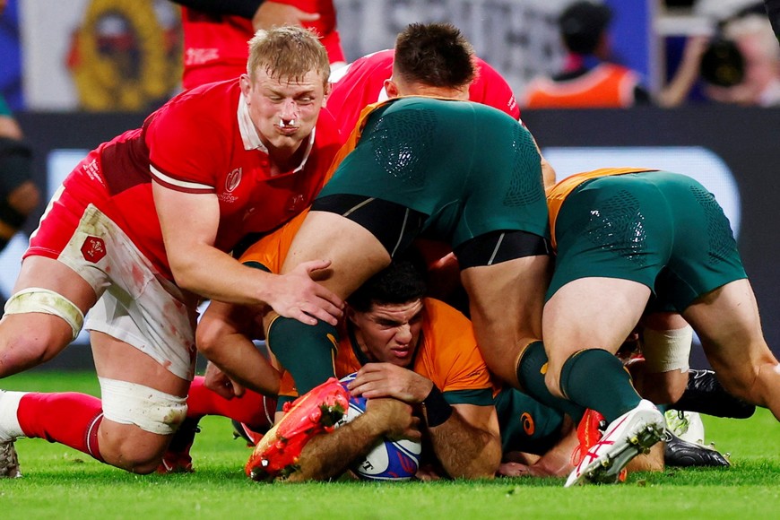 Rugby Union - Rugby World Cup 2023 - Pool C - Wales v Australia - OL Stadium, Lyon, France - September 24, 2023
Australia's Ben Donaldson in action with Wales' Jac Morgan REUTERS/Gonzalo Fuentes     TPX IMAGES OF THE DAY