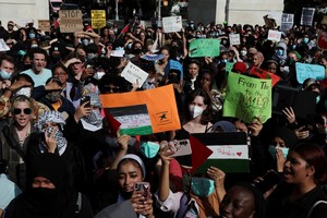 People attend a demonstration to express solidarity with Palestinians in Gaza, amid the ongoing conflict between Israel and Hamas, as part of a student walkout by students of New York University, in New York City, U.S., October 25, 2023. REUTERS/Shannon Stapleton