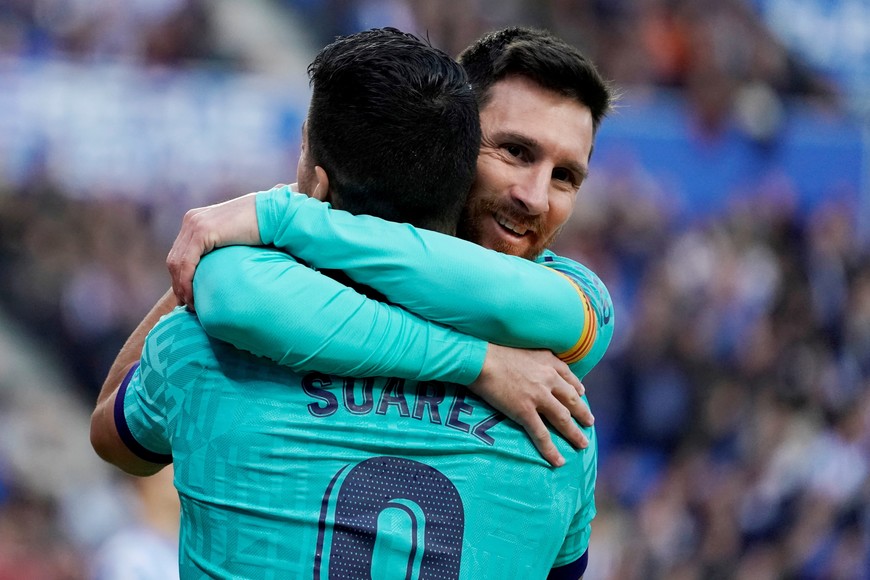 FILE PHOTO: Soccer Football - La Liga Santander - Real Sociedad v FC Barcelona - Anoeta Stadium, San Sebastian, Spain - December 14, 2019   Barcelona's Luis Suarez celebrates scoring their second goal with Lionel Messi    REUTERS/Vincent West/File Photo