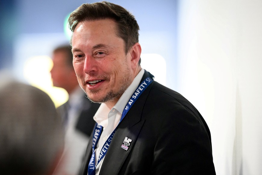 BLETCHLEY, ENGLAND - NOVEMBER 01: SpaceX, X (formerly known as Twitter), and Tesla CEO Elon Musk speaks with other delegates during day one of the AI Safety Summit at Bletchley Park on November 01, 2023 in Bletchley, England. The UK Government are hosting the AI Safety Summit bringing together international governments, leading AI companies, civil society groups and experts in research to consider the risks of AI, especially at the frontier of development, and discuss how they can be mitigated through internationally coordinated action.     Leon Neal/Pool via REUTERS