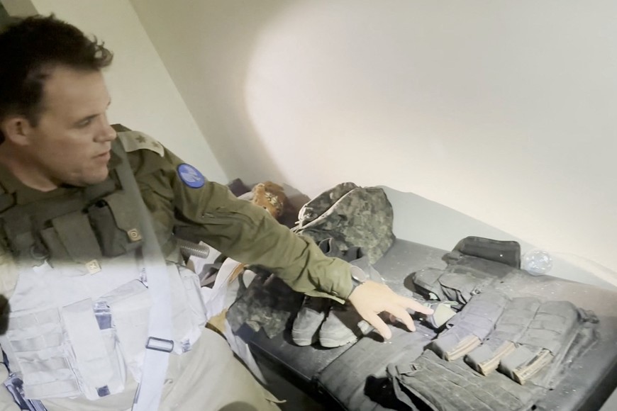 An Israeli officer points at equipment that he says was discovered in a bag at the Al Shifa hospital complex, amid the Israeli military's ground operation against Palestinian Islamist group Hamas, in Gaza City, November 15, 2023 in this still image taken from video. Israeli forces said the "beating heart" of the Hamas fighters' operations was headquartered in tunnels beneath the hospital. Hamas denied the accusation and on Wednesday dismissed the Israeli statements as "lies and cheap propaganda."   Israeli Army/Handout via REUTERS    THIS IMAGE HAS BEEN SUPPLIED BY A THIRD PARTY.