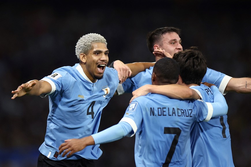 Soccer Football - World Cup - South American Qualifiers - Argentina v Uruguay - Estadio La Bombonera, Buenos Aires, Argentina - November 16, 2023
Uruguay's Ronald Araujo celebrates scoring their first goal with teammates REUTERS/Agustin Marcarian