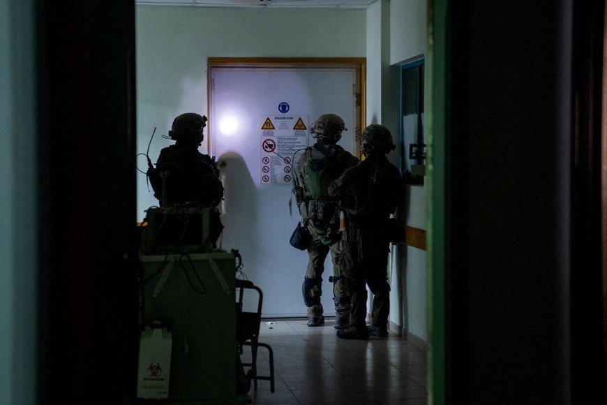 Israeli soldiers inspect the Al Shifa hospital complex, amid their ground operation against Palestinian Islamist group Hamas, in Gaza City, November 15, 2023 in this handout image. Israel Defense Forces/Handout via REUTERS    THIS IMAGE HAS BEEN SUPPLIED BY A THIRD PARTY. BEST QUALITY AVAILABLE 
     TPX IMAGES OF THE DAY