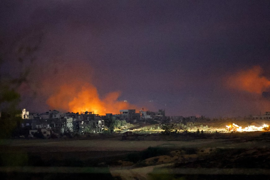 Flames rise during Israeli air strikes over Gaza, as seen from southern Israel, amid the ongoing conflict between Israel and the Palestinian group Hamas, November 22, 2023. REUTERS/Alexander Ermochenko