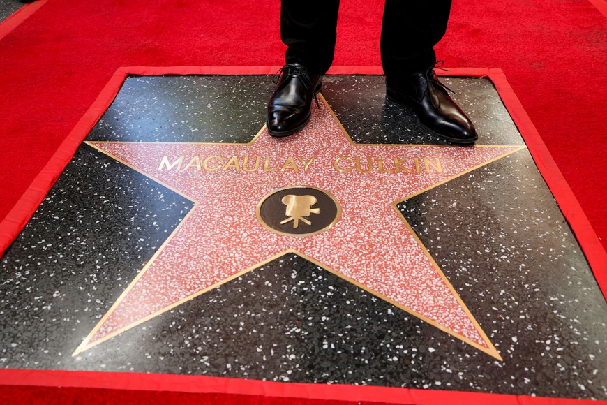 Actor Macaulay Culkin stands on his star on the Hollywood Walk of Fame, in Los Angeles, California, U.S. December 1, 2023. REUTERS/Mario Anzuoni