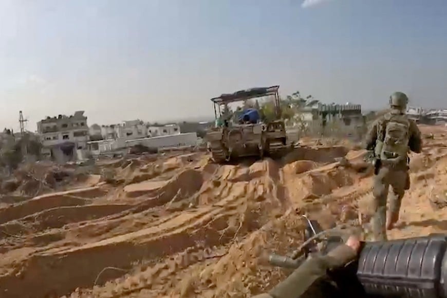 Members of the Israeli army operate in a location given as Gaza, amid the ongoing conflict between Israel and the Palestinian Islamist group Hamas, in this still image obtained from a handout video released December 3, 2023.    Israel Defense Forces/Handout via REUTERS    THIS IMAGE HAS BEEN SUPPLIED BY A THIRD PARTY