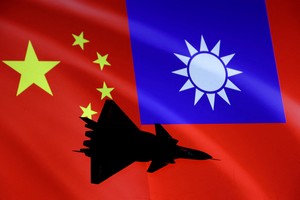 FILE PHOTO: Airplane is seen in front of Chinese and Taiwanese flags in this illustration, August 6, 2022. REUTERS/Dado Ruvic/Illustration/File Photo