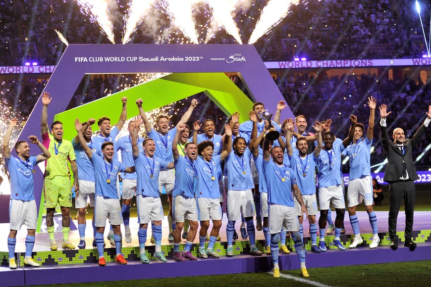 Soccer Football - Club World Cup - Final - Manchester City v Fluminense - King Abdullah Sports City, Jeddah, Saudi Arabia - December 22, 2023
Manchester City's Kyle Walker lifts the trophy alongside teammates after winning the Club World Cup final REUTERS/Osama Abd El Naby