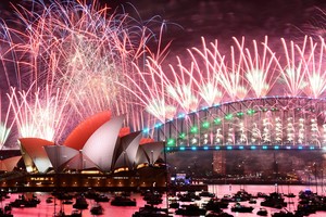 Fireworks are seen over the Sydney Opera House and Harbour Bridge during New Year's Eve celebrations in Sydney, Australia January 1, 2024. AAP Image/Dan Himbrechts via REUTERS        ATTENTION EDITORS - THIS IMAGE WAS PROVIDED BY A THIRD PARTY. NO RESALES. NO ARCHIVE. AUSTRALIA OUT. NEW ZEALAND OUT. NO COMMERCIAL OR EDITORIAL SALES IN NEW ZEALAND. NO COMMERCIAL OR EDITORIAL SALES IN AUSTRALIA.