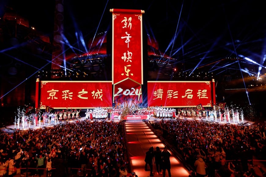 Artists react during the New Year's eve celebration at the Shougang Park in Beijing, China January 1, 2024. REUTERS/Tingshu Wang