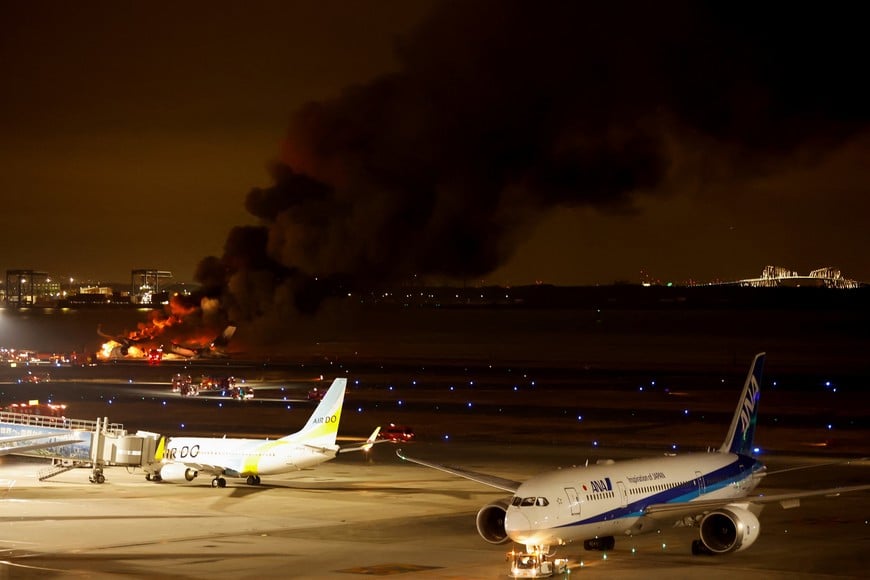 Japan Airlines' A350 airplane is on fire at Haneda international airport in Tokyo, Japan January 2, 2024. REUTERS/Issei Kato