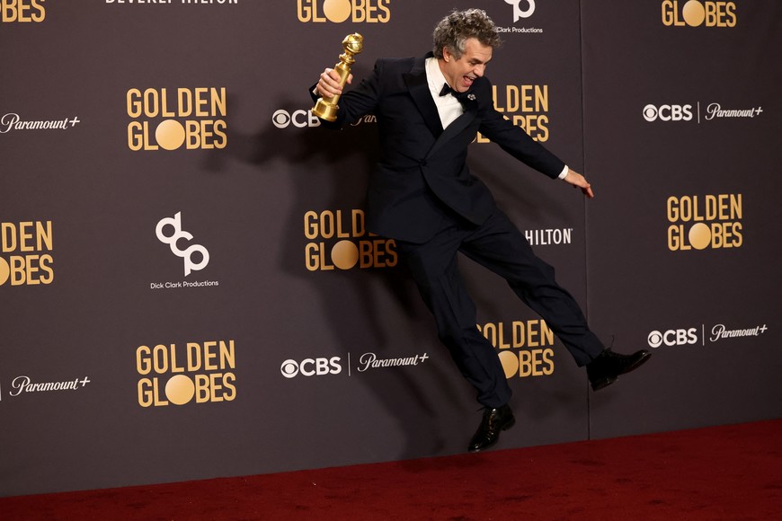 Mark Ruffalo poses with the award for Best Motion Picture - Musical or Comedy for "Poor Things", at the 81st Annual Golden Globe Awards in Beverly Hills, California, U.S., January 7, 2024. REUTERS/Mario Anzuoni