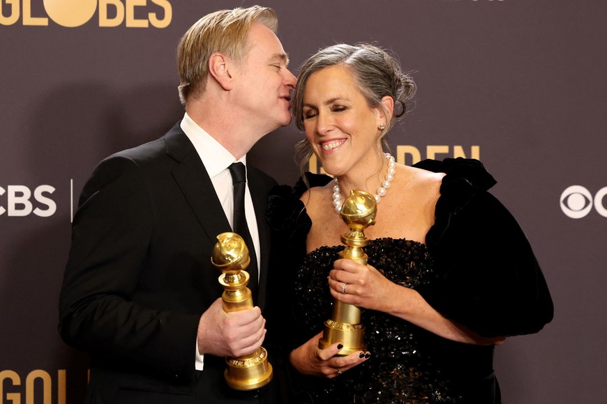 Christopher Nolan and Emma Thomas pose with the awards for Best Director and Best Motion Picture - Drama for "Oppenheimer" at the 81st Annual Golden Globe Awards in Beverly Hills, California, U.S., January 7, 2024. REUTERS/Mario Anzuoni